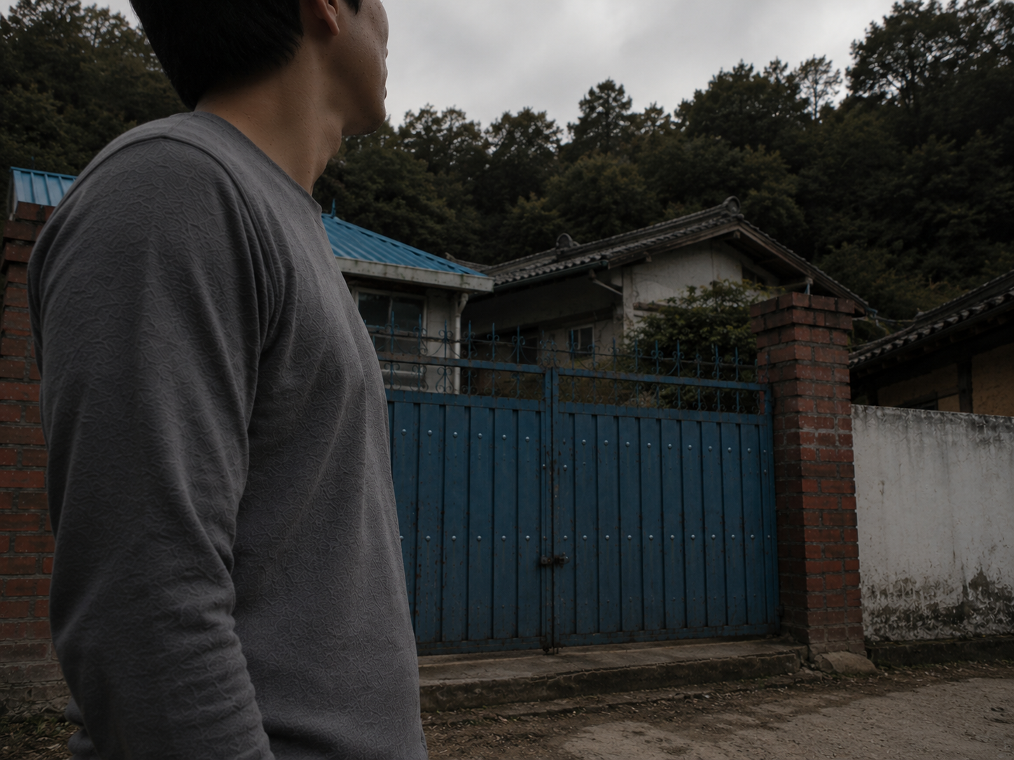 A dimly lit rural Korean home exterior