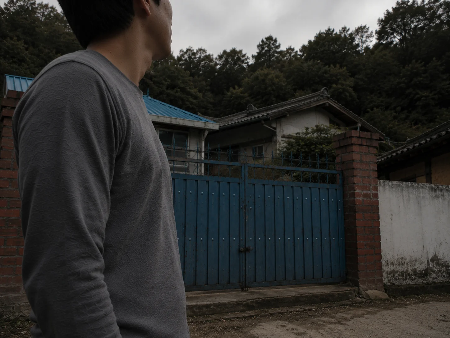 A dimly lit rural Korean home exterior