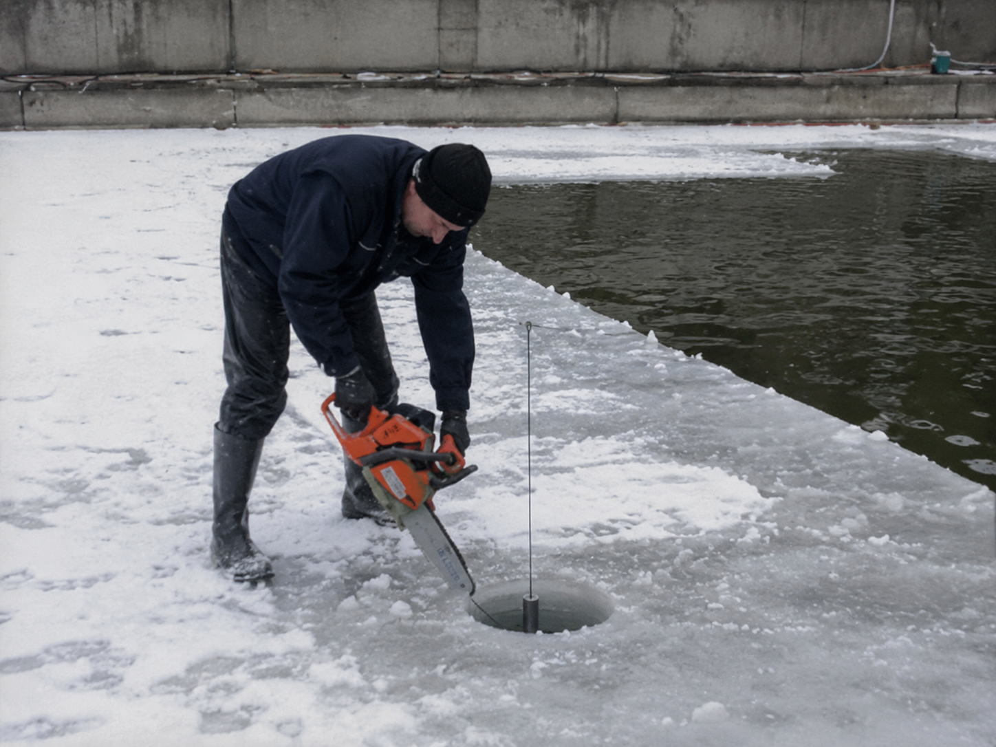 A frozen lake in Alaska with ice fishing equipment