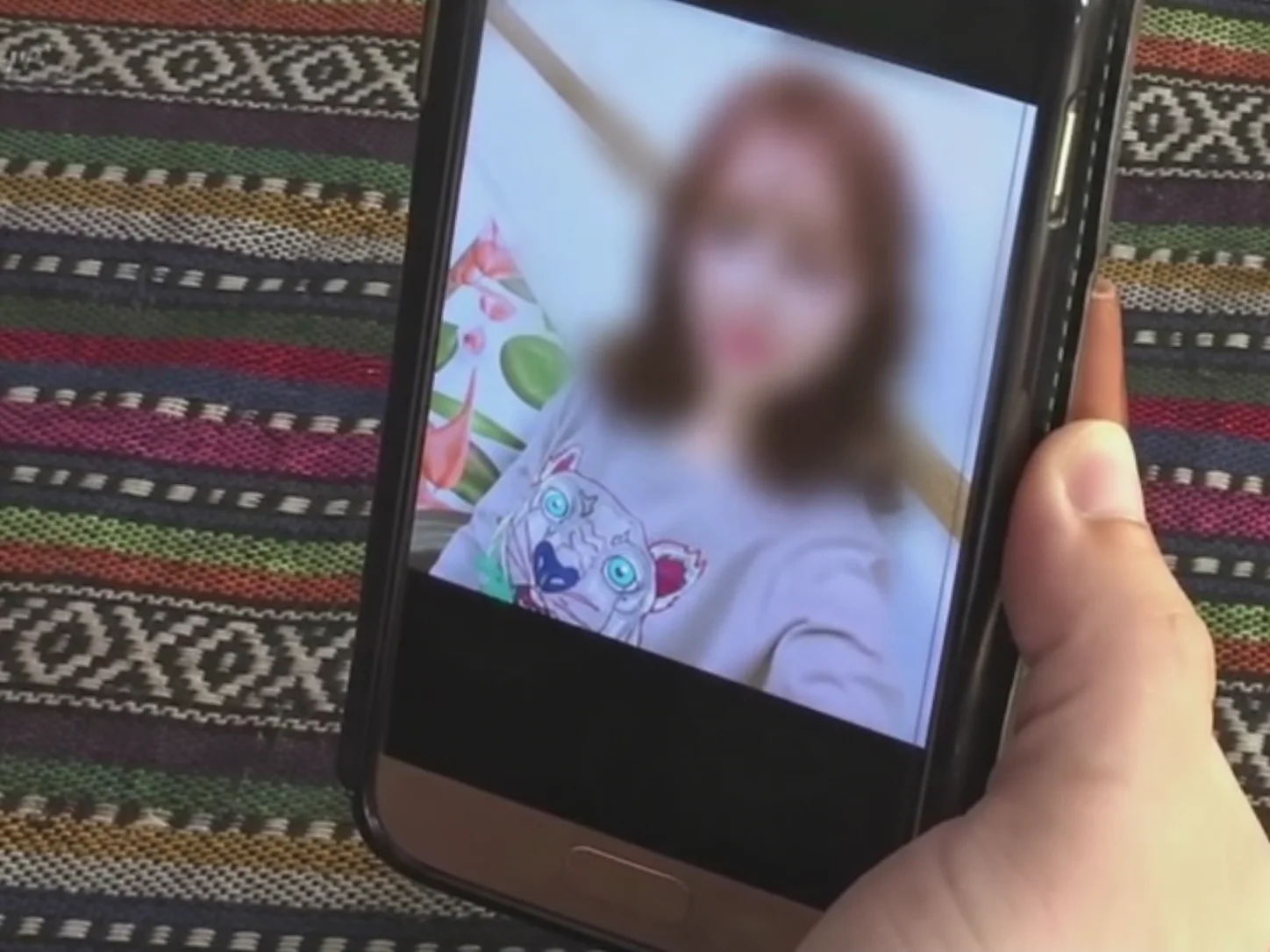 A phone displaying a social media post