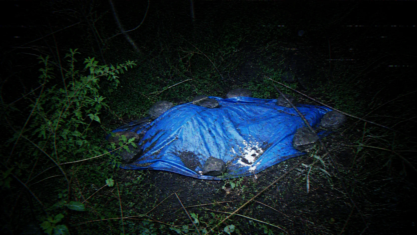 A blue plastic tarp