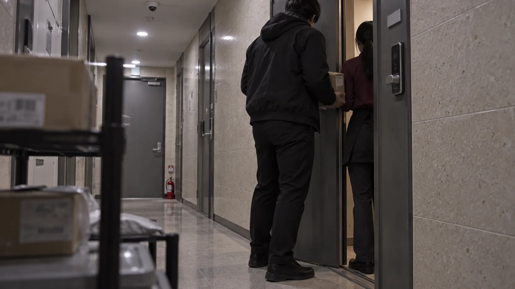A man posing as a delivery worker at a woman's front door