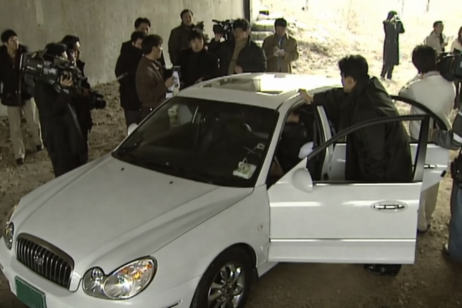 Police discovering a damaged phone inside a suspect vehicle