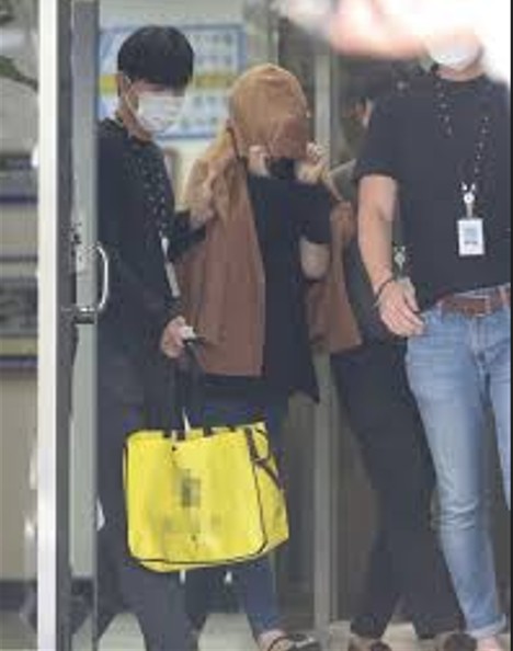 Korean police arresting Hakyung Lee after years in hiding