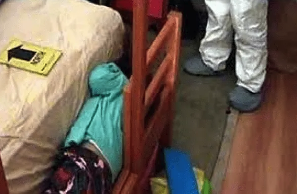 Investigators examining Paulette's bedroom during the search