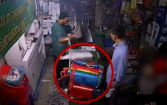 Investigators reviewing security footage in the case